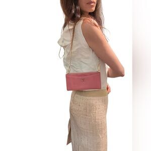 Chanel Pink Clutch with Iconic Logo and Minimalist Design